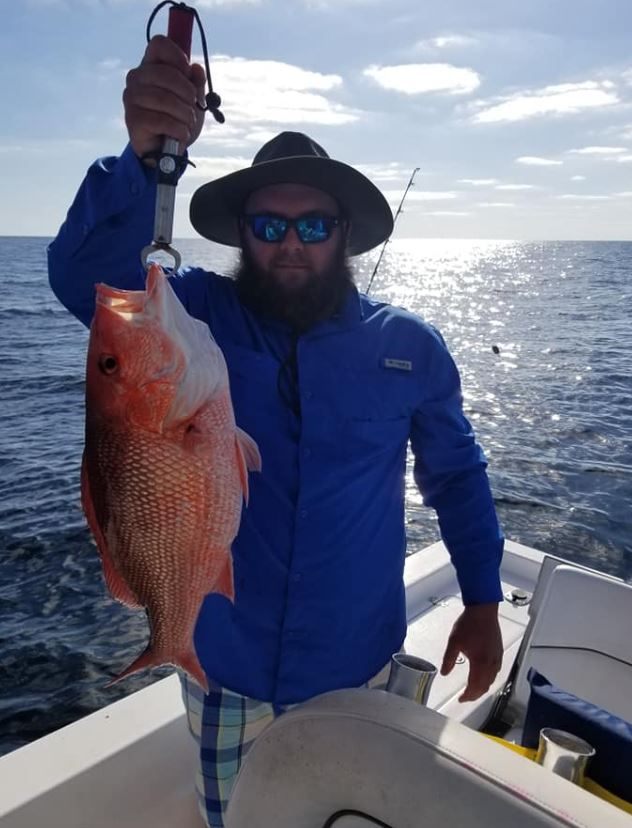 Lone angler fishing in the waters of Orange Beach