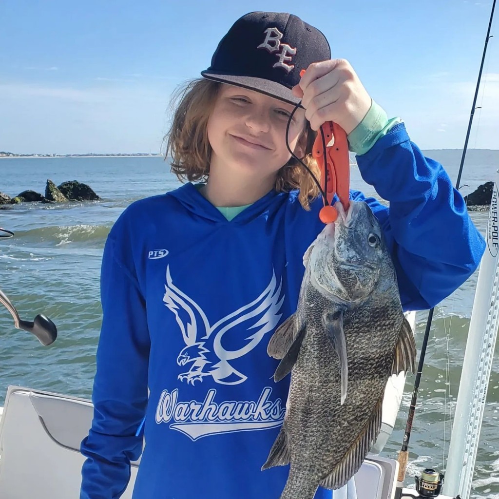 A photo of a 14-inch black drum fish caught during fishing in North Charleston