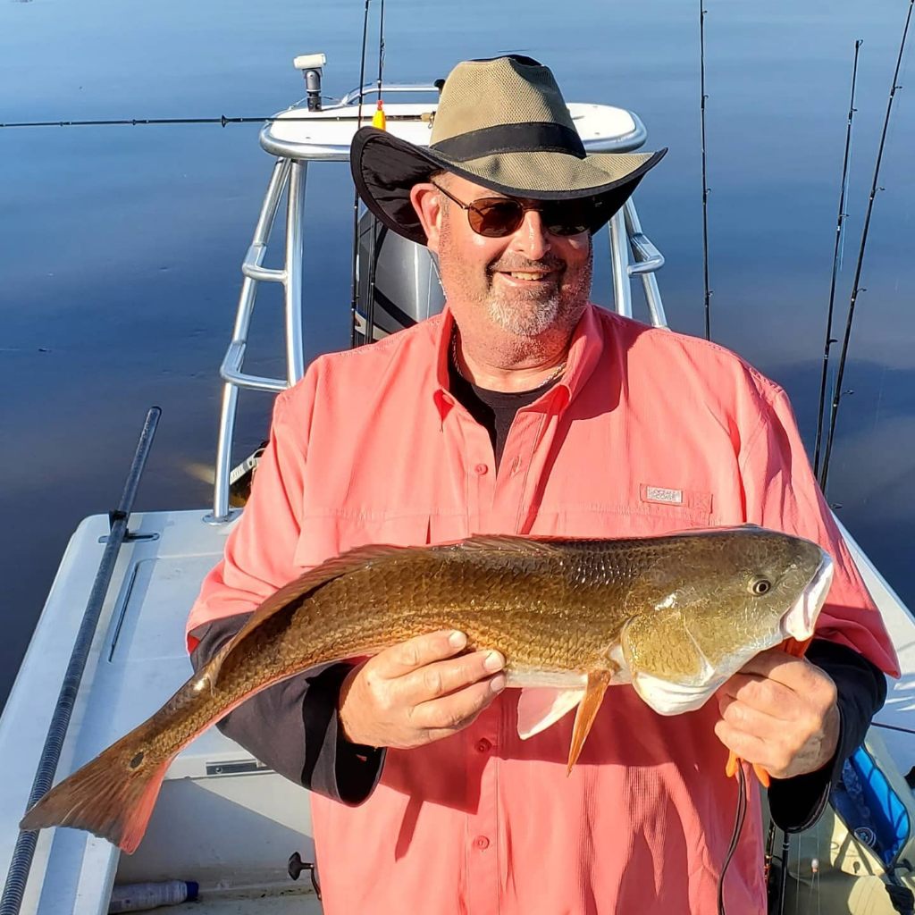 Angler holding a 22-inch fish in North Charleston