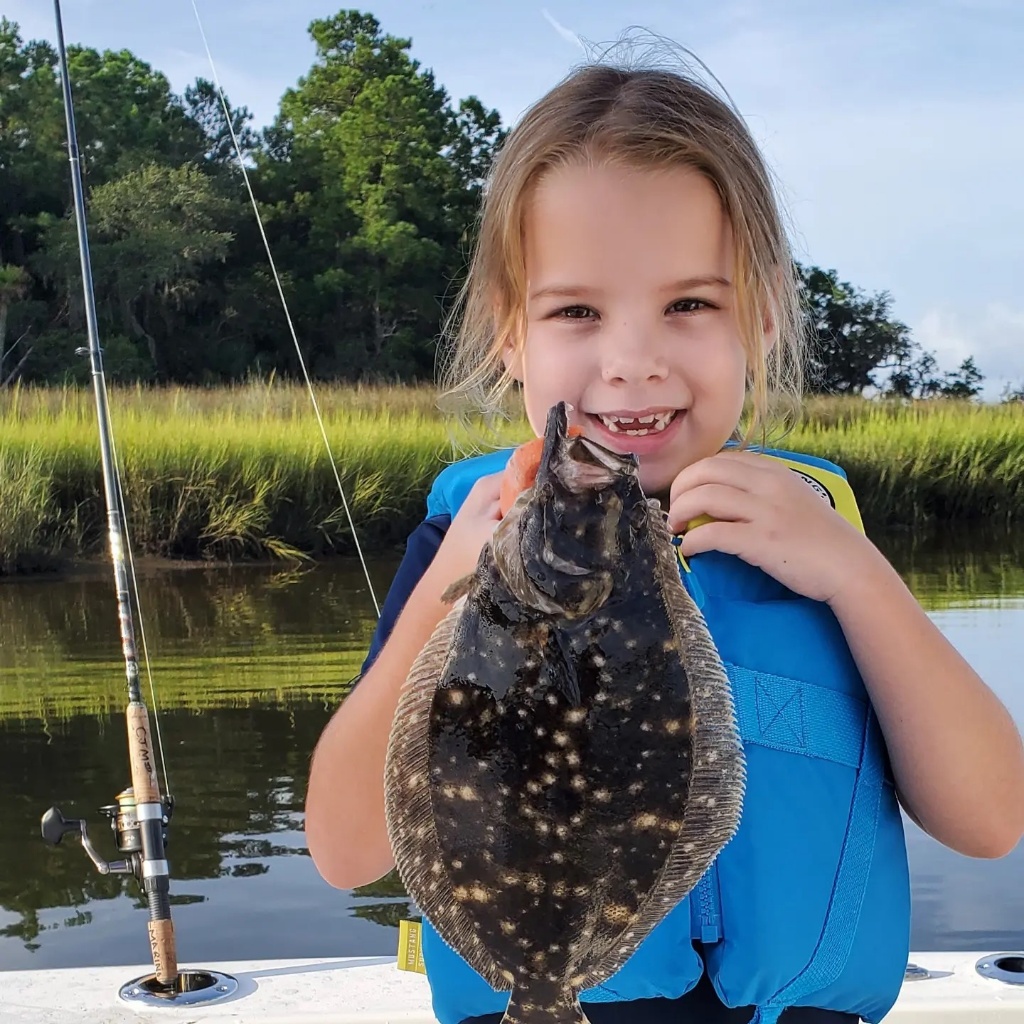 Angler catches a summer flounder in North Charleston