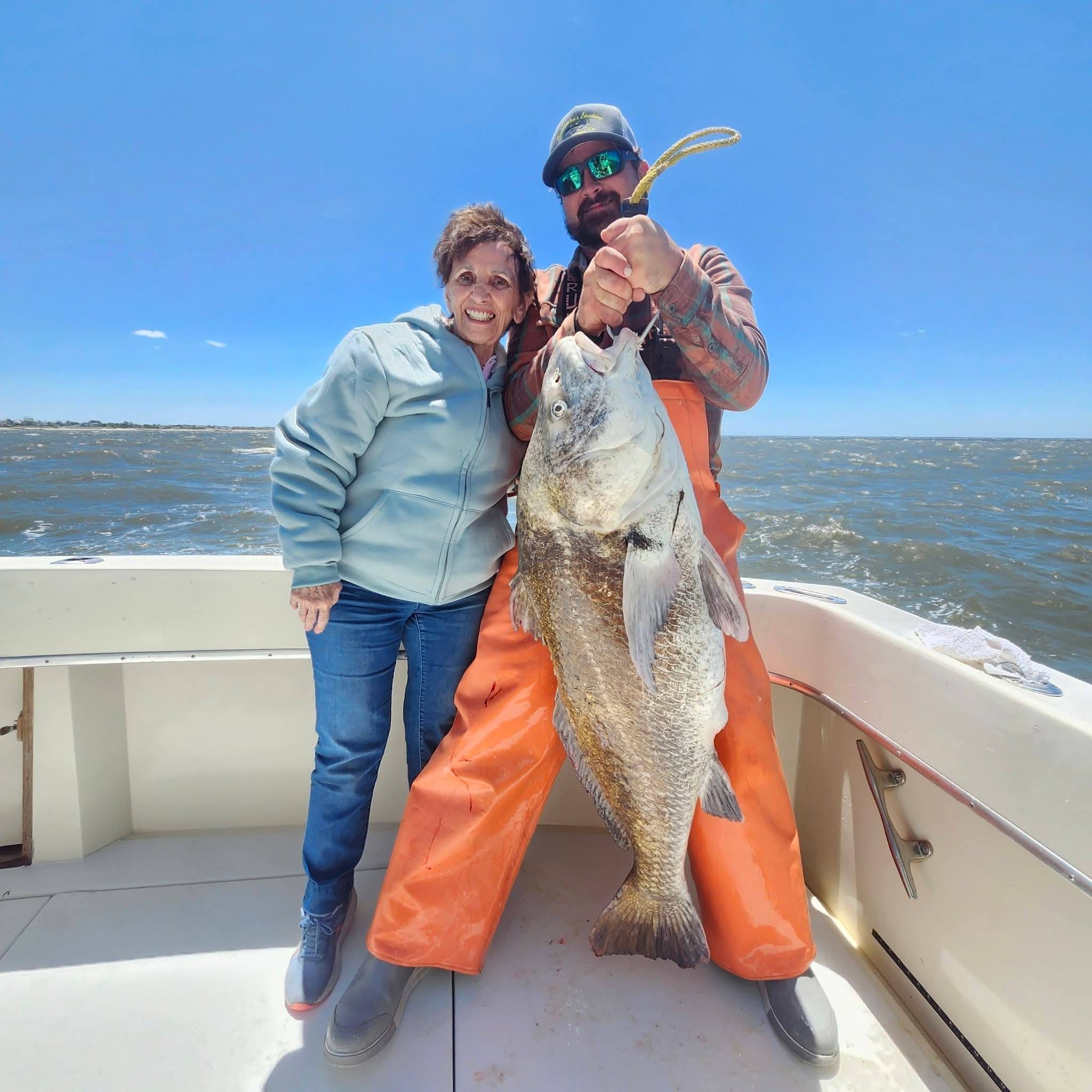 Large black drum fish caught fishing in Cape May NJ displayed on boat deck