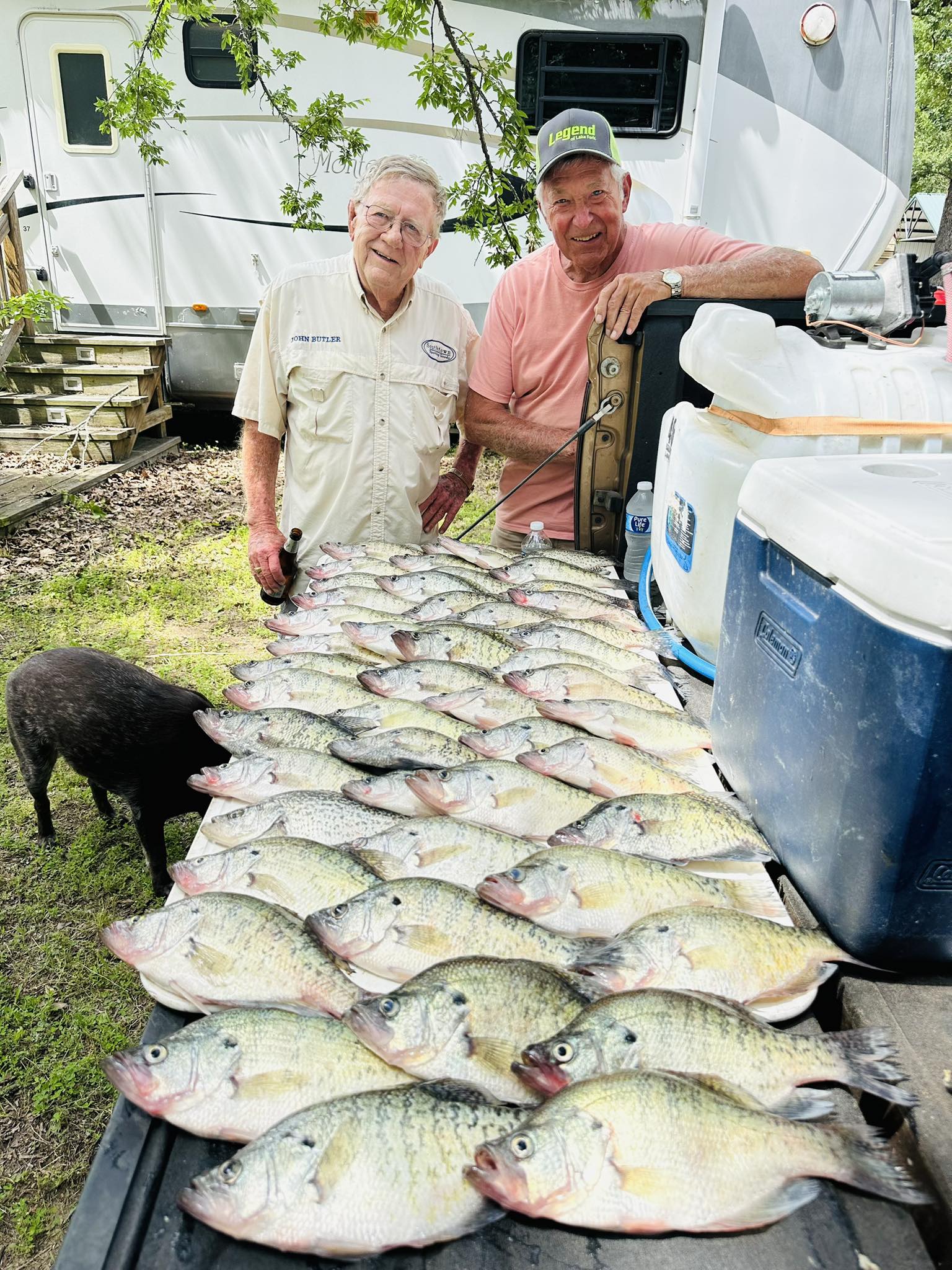 Two anglers holding up their fishing rods in Yantis