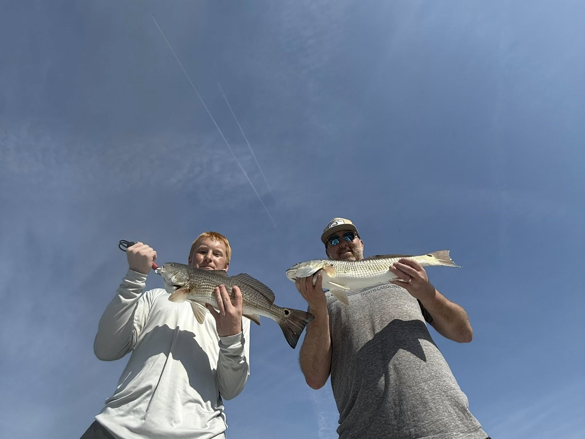 8-hour Hampstead inshore fishing charter boat targeting redfish, trout, flounder for up to 4 guests