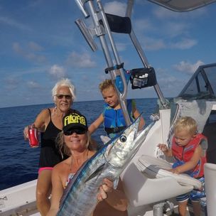Three people fishing at Lake Worth
