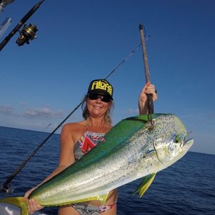 A person fishing in Lake Worth