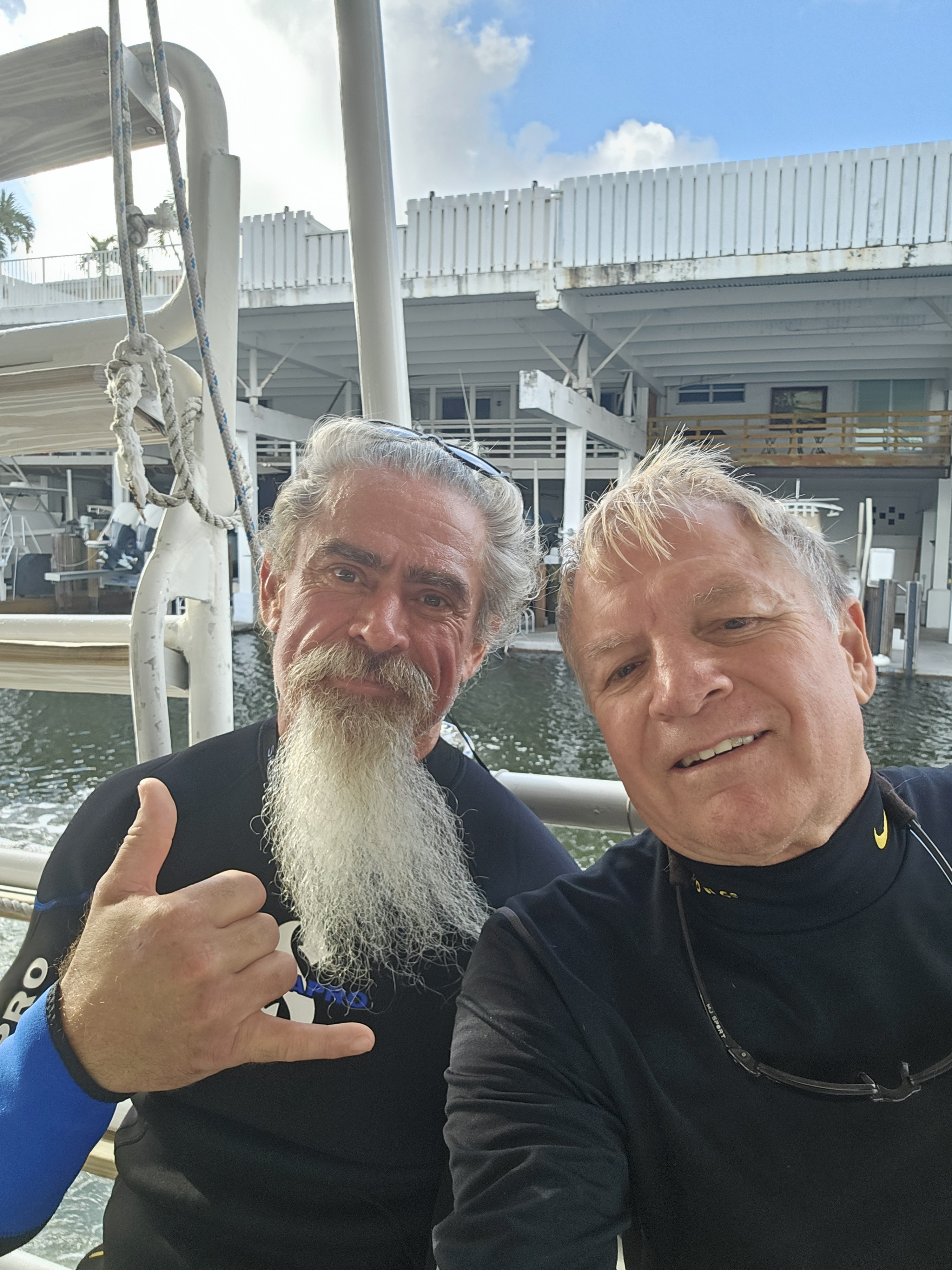 Two people on a boat at a marina in Spring Hill FL preparing for water sports activity