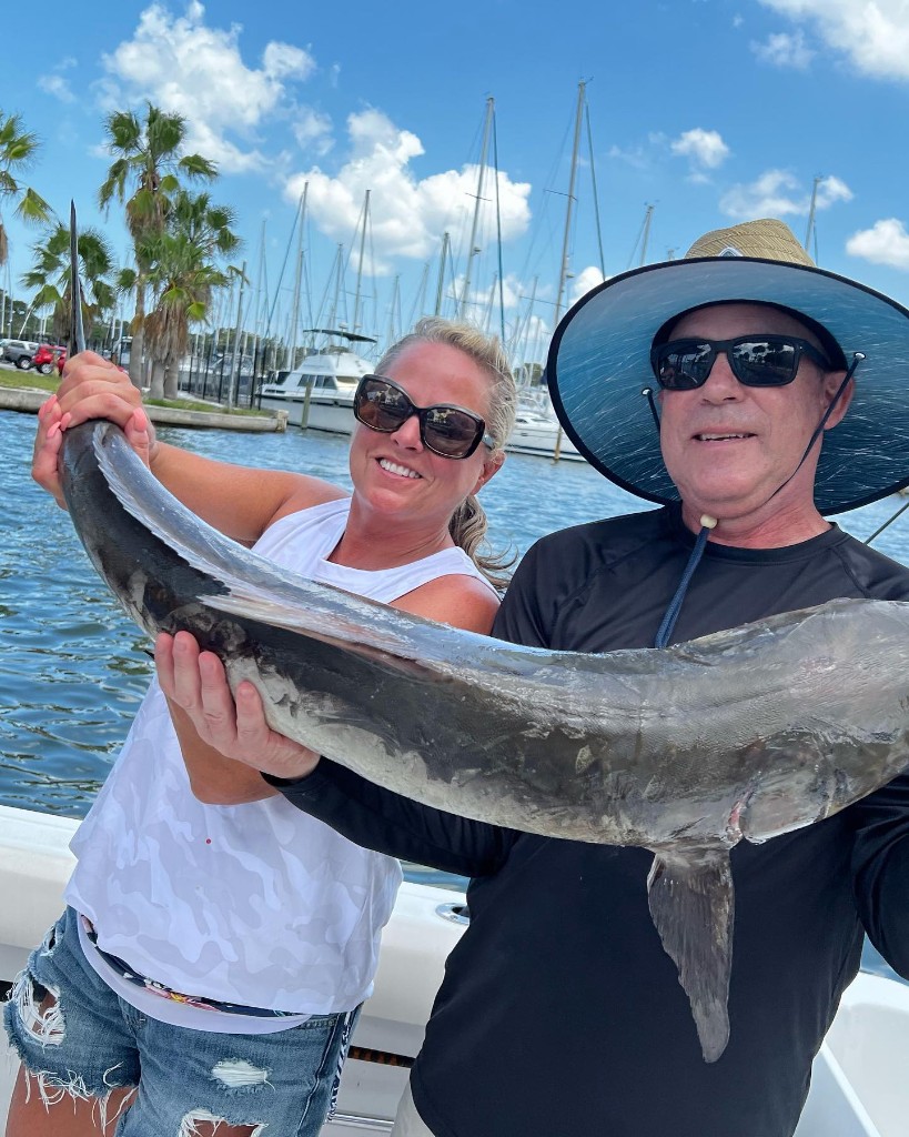 A couple fishing in Florida with a big fish