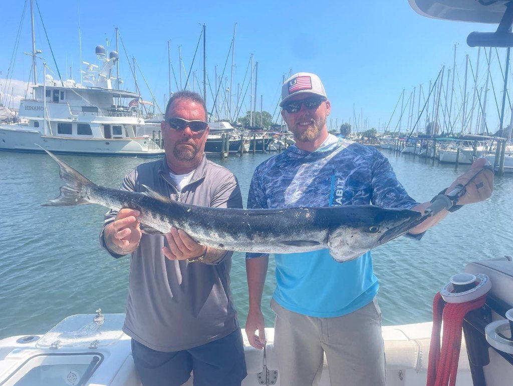 Two anglers fishing in Gulfport with a 35-inch catch
