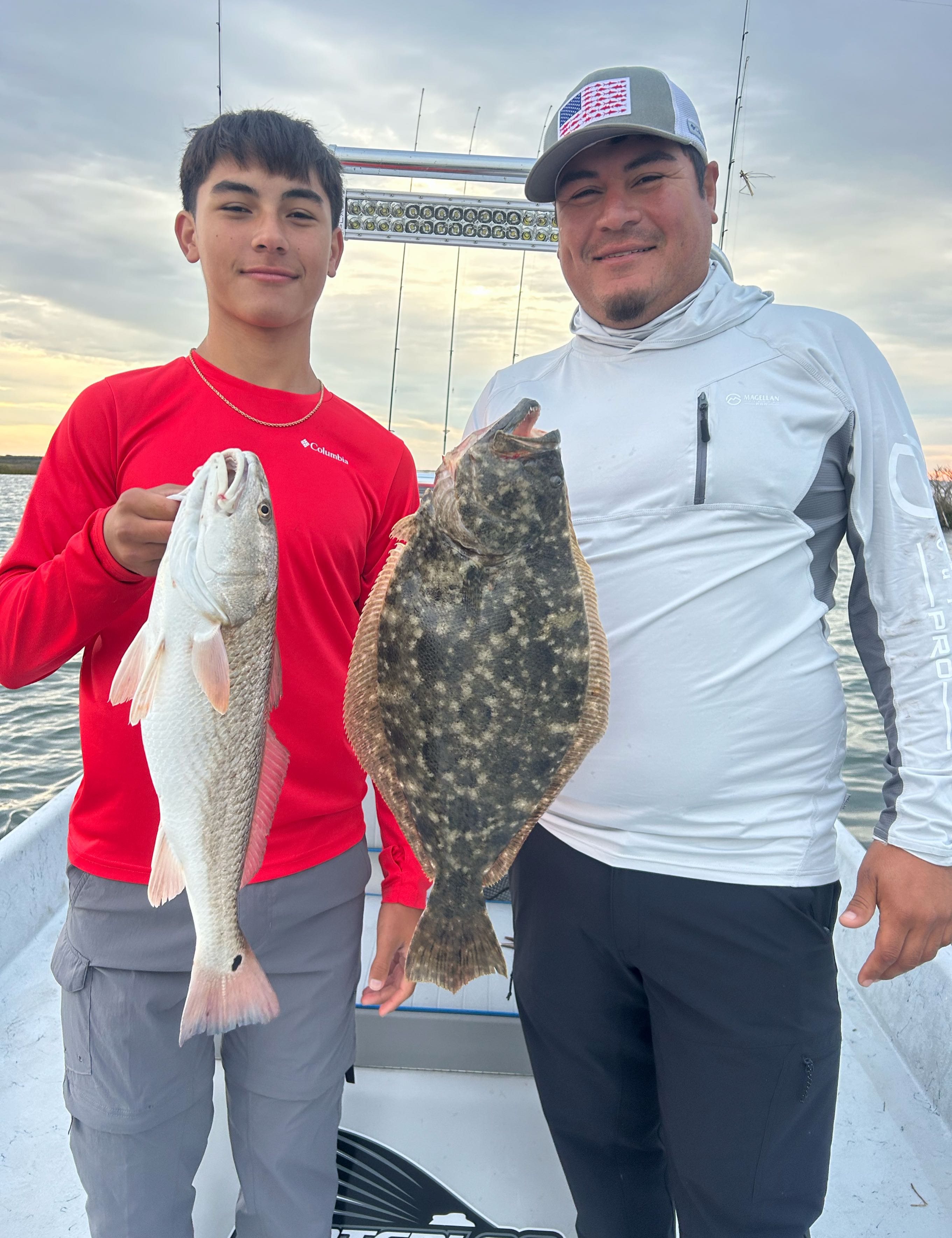 Two summer flounder and redfish caught while fishing in Aransas Pass