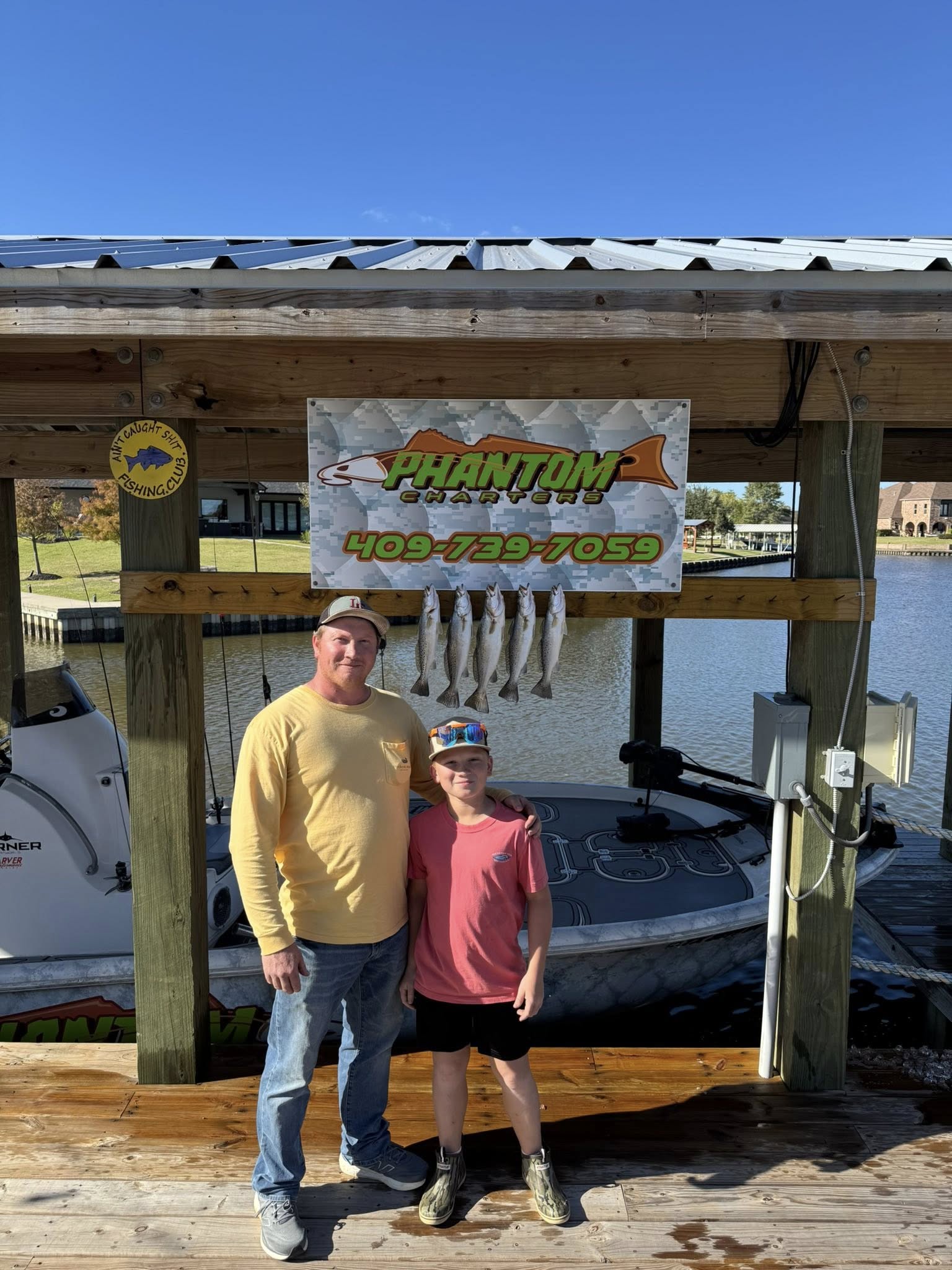 Fishing charter display board showing caught fish at marina dock in Bridge City TX