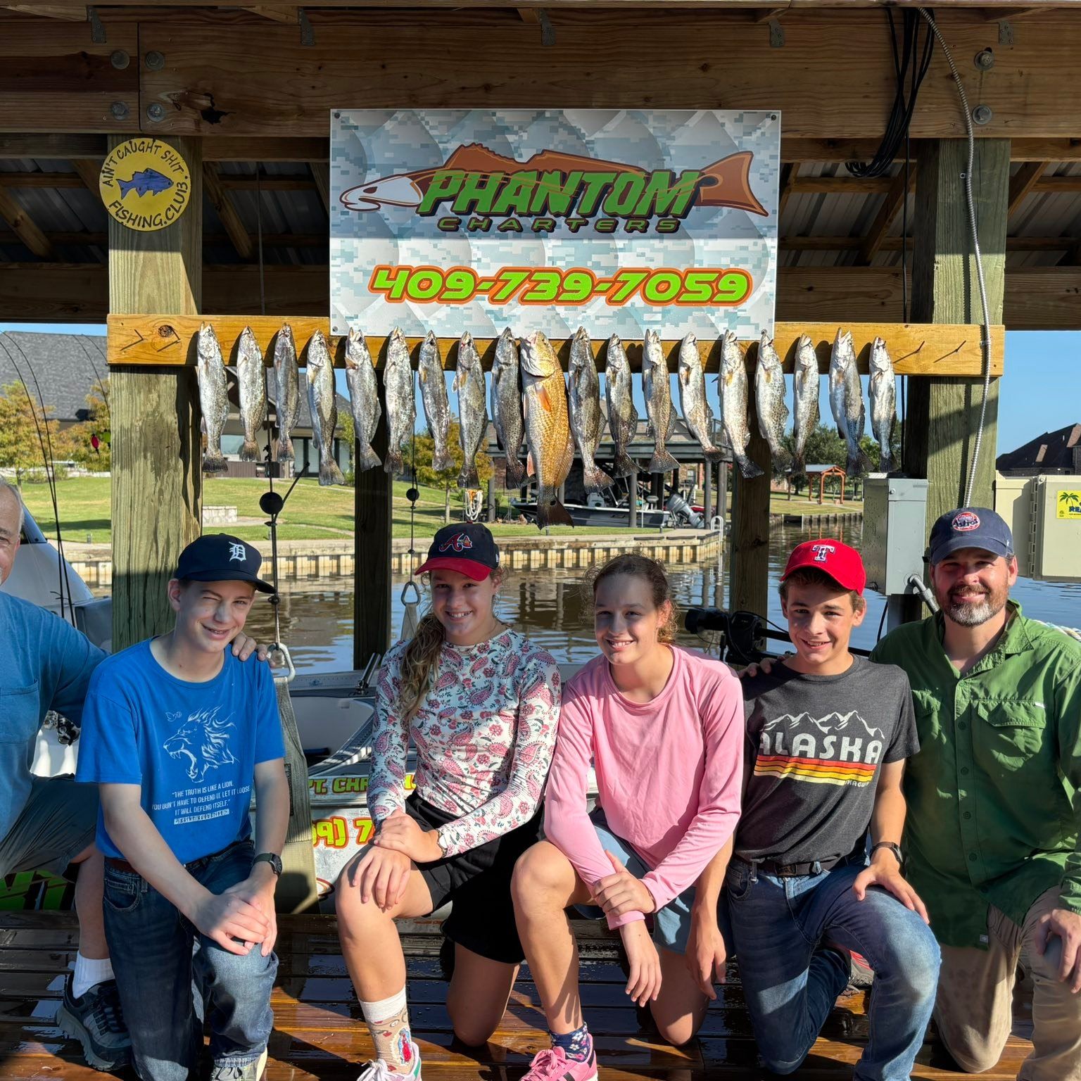 Fishing charter display with multiple speckled trout catch at Bridge City TX marina