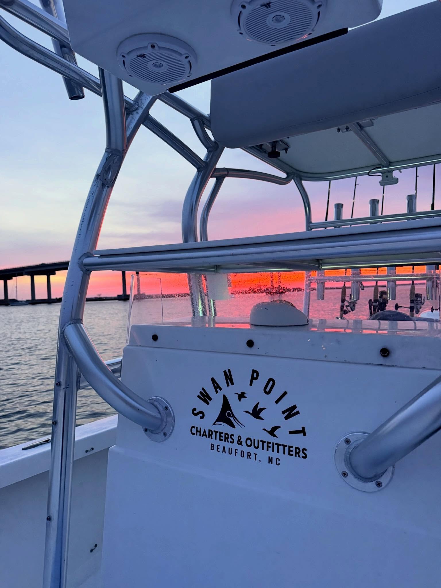 Charter fishing boat Swan Point at sunset in Morehead City NC waters