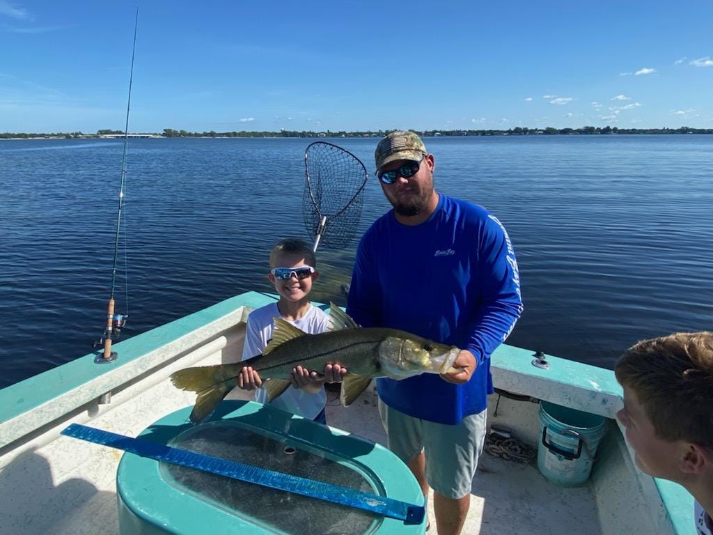 A large snook being caught in Holmes Beach
