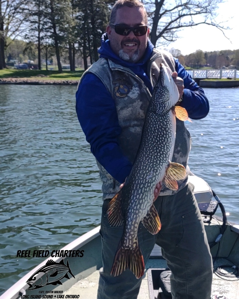 Angler holding a 26-inch fish in CT