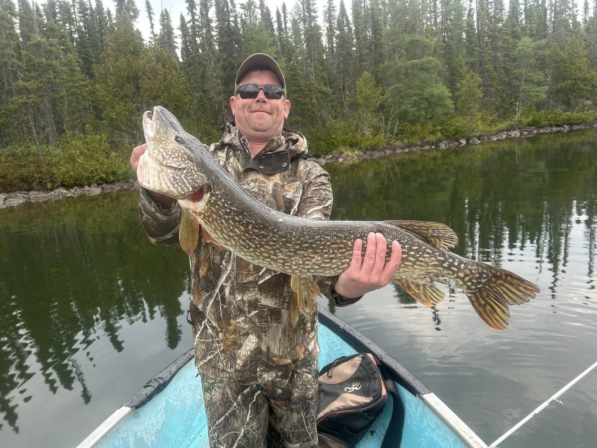 A fisherman with a 35-inch catch in Ontario