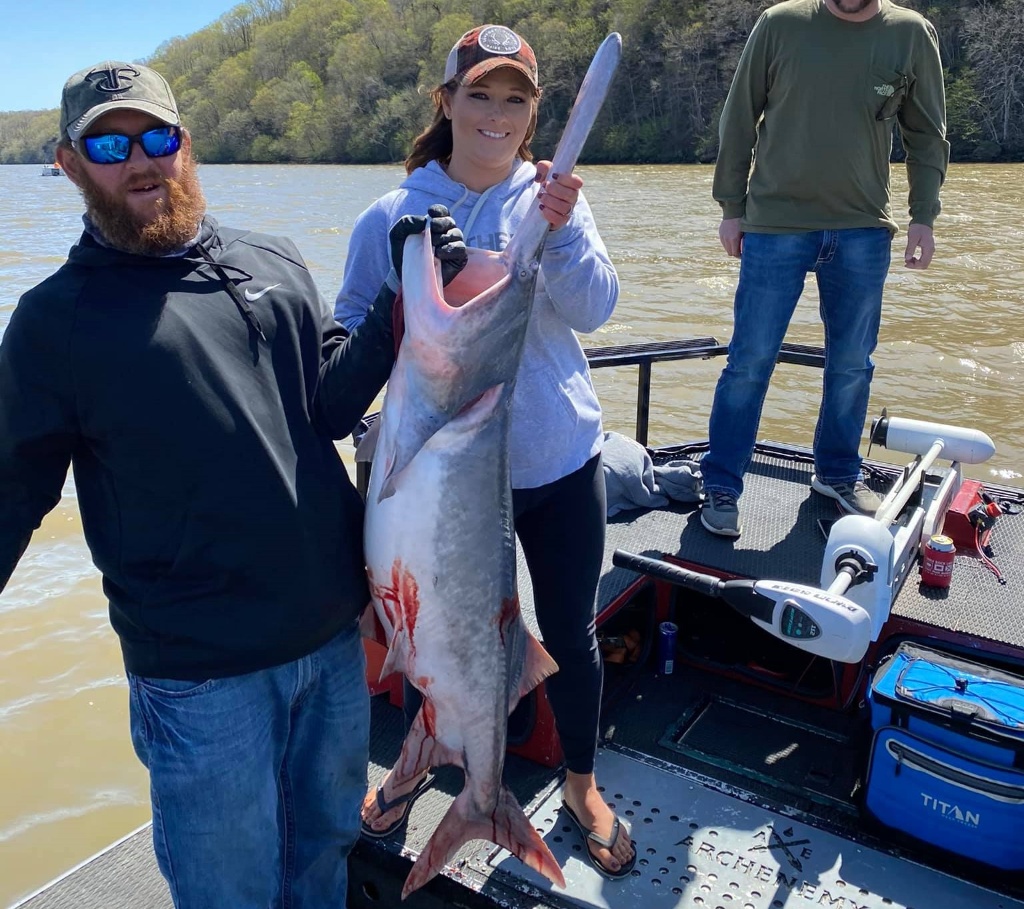 Two people fishing in Camdenton with a 28-inch fish