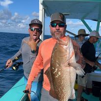 A group of 3 people fishing in the waters of Okeechobee