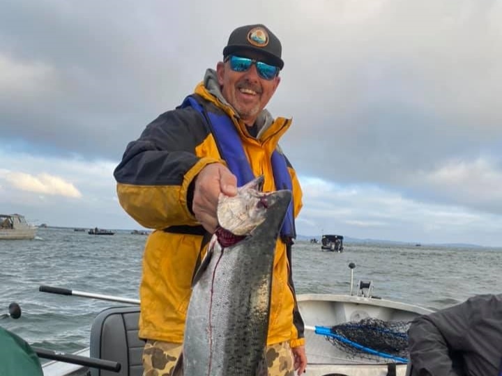 Angler with a 15-inch fish in Portland