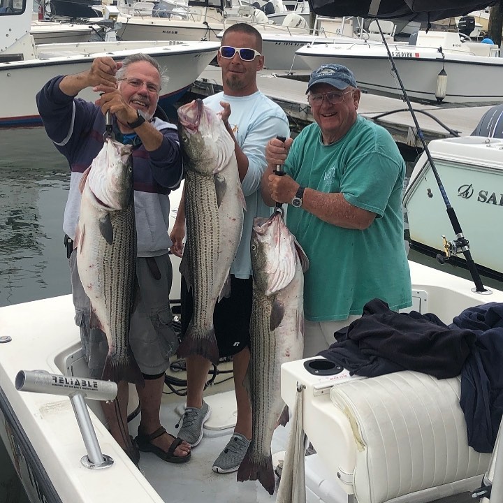 Cape Cod inshore fishing charter boat departing Sesuit Harbor for striped bass and bluefish