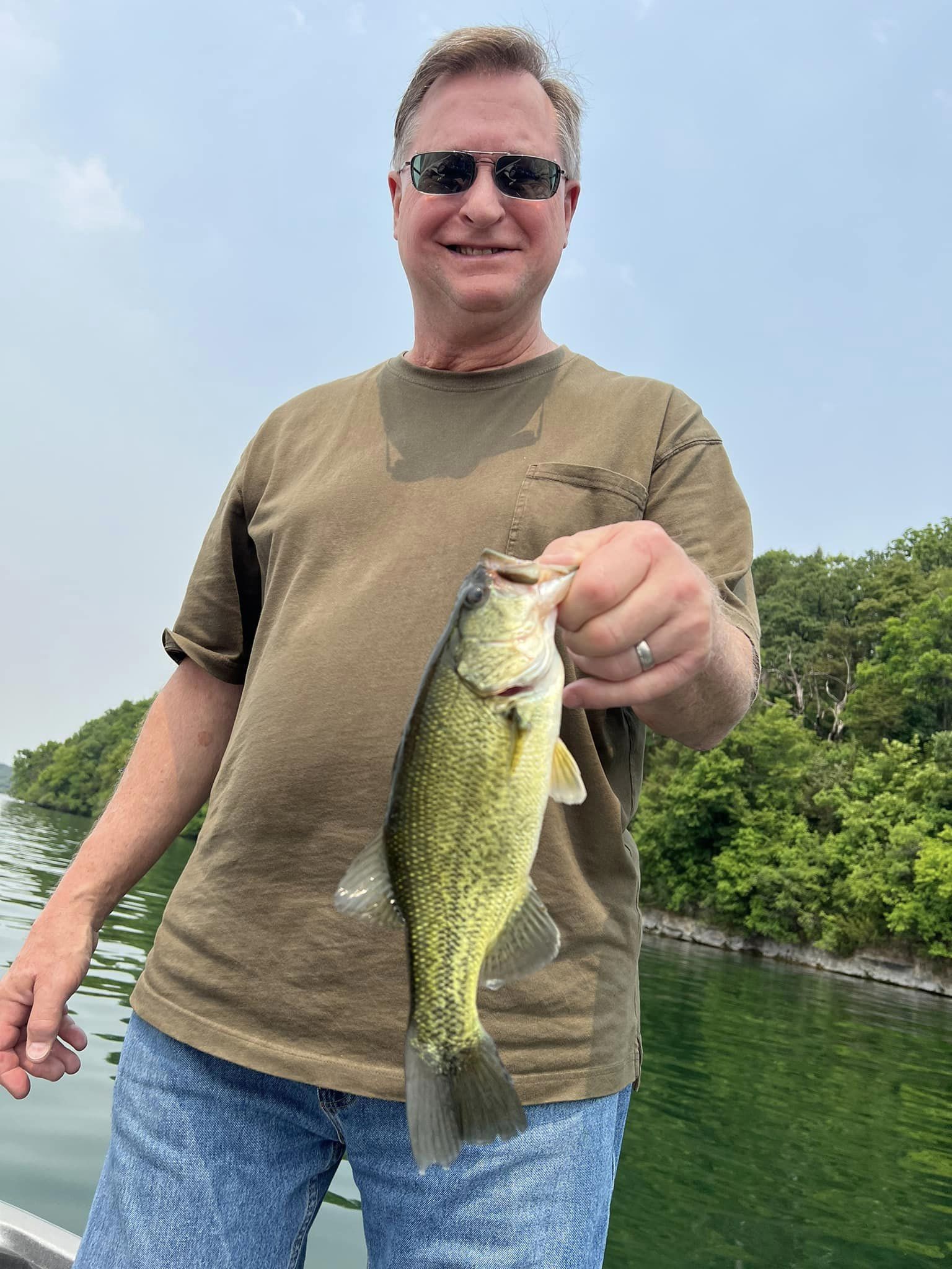 Person fishing with rod and reel at Fox Lake