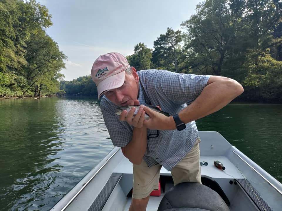 One fisherman catching fish in Little Red River