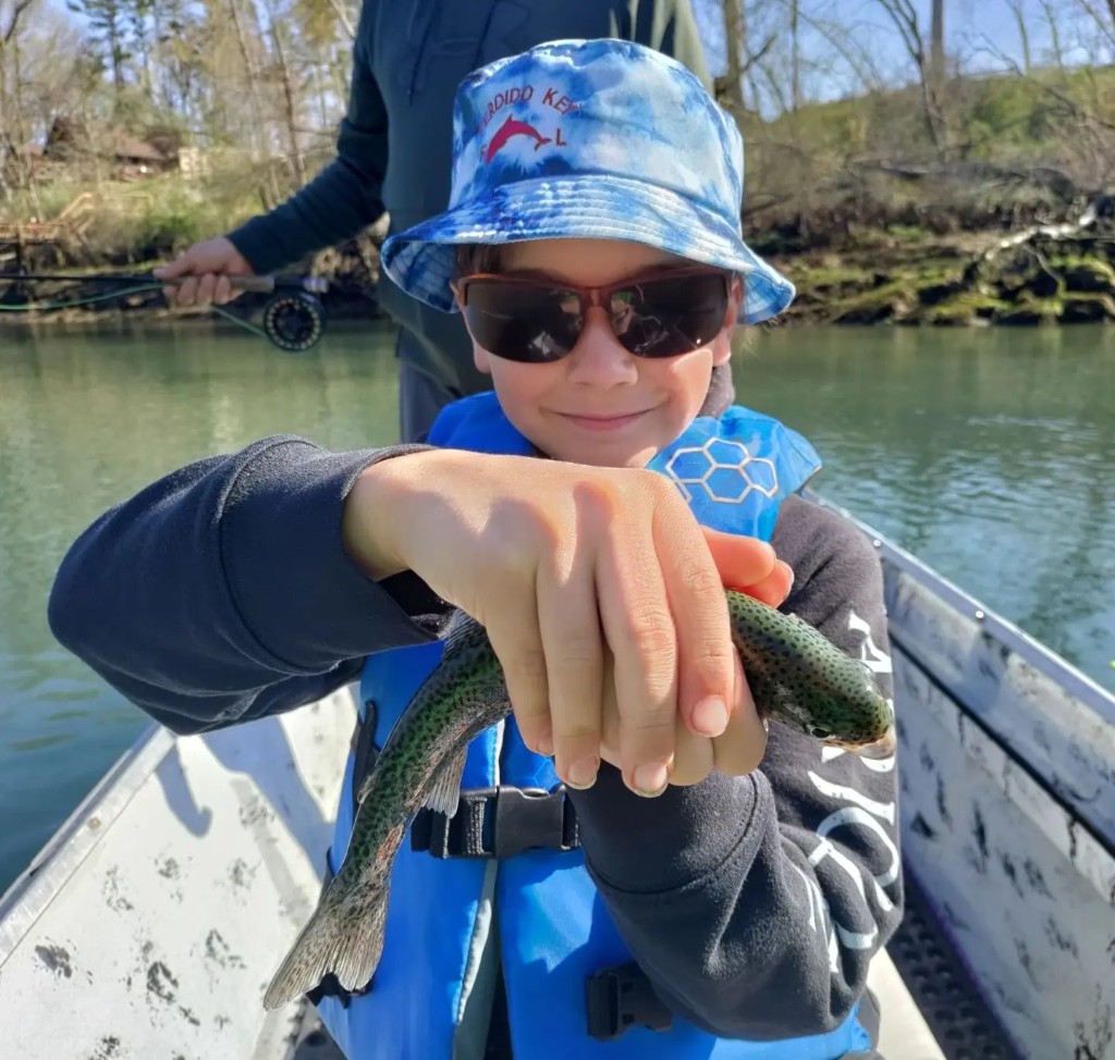 Angler holding a fish in AR