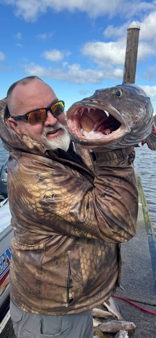 Large lingcod catch with open mouth showing teeth on fishing boat near Roseburg OR