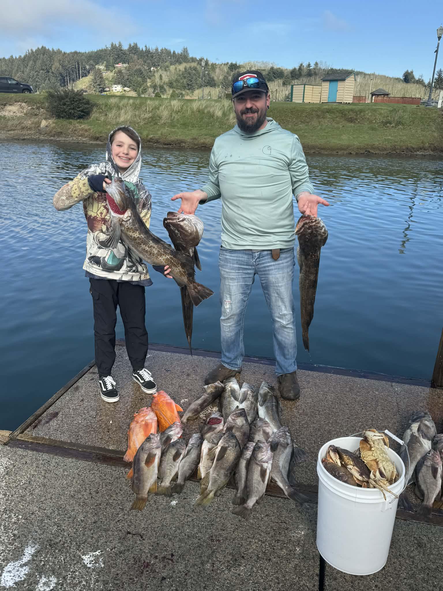 Successful fishing trip in Roseburg OR displaying multiple lingcod and other fish species caught