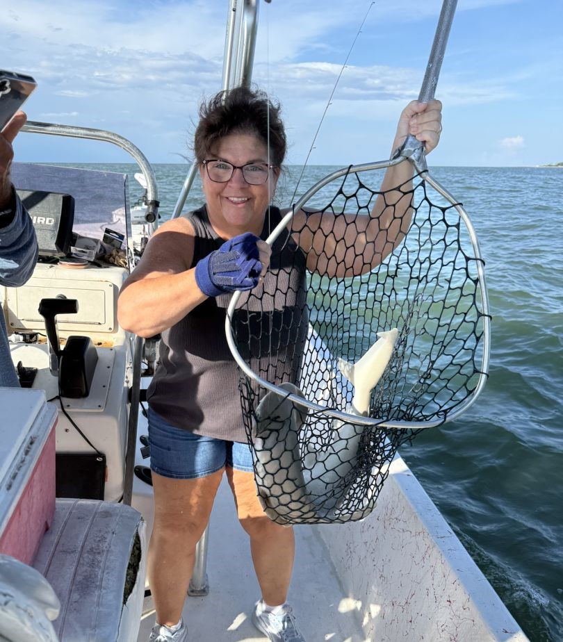 Fish caught in landing net on fishing boat in Fort Morgan Alabama waters