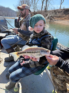 Two anglers enjoying a fishing trip in AR
