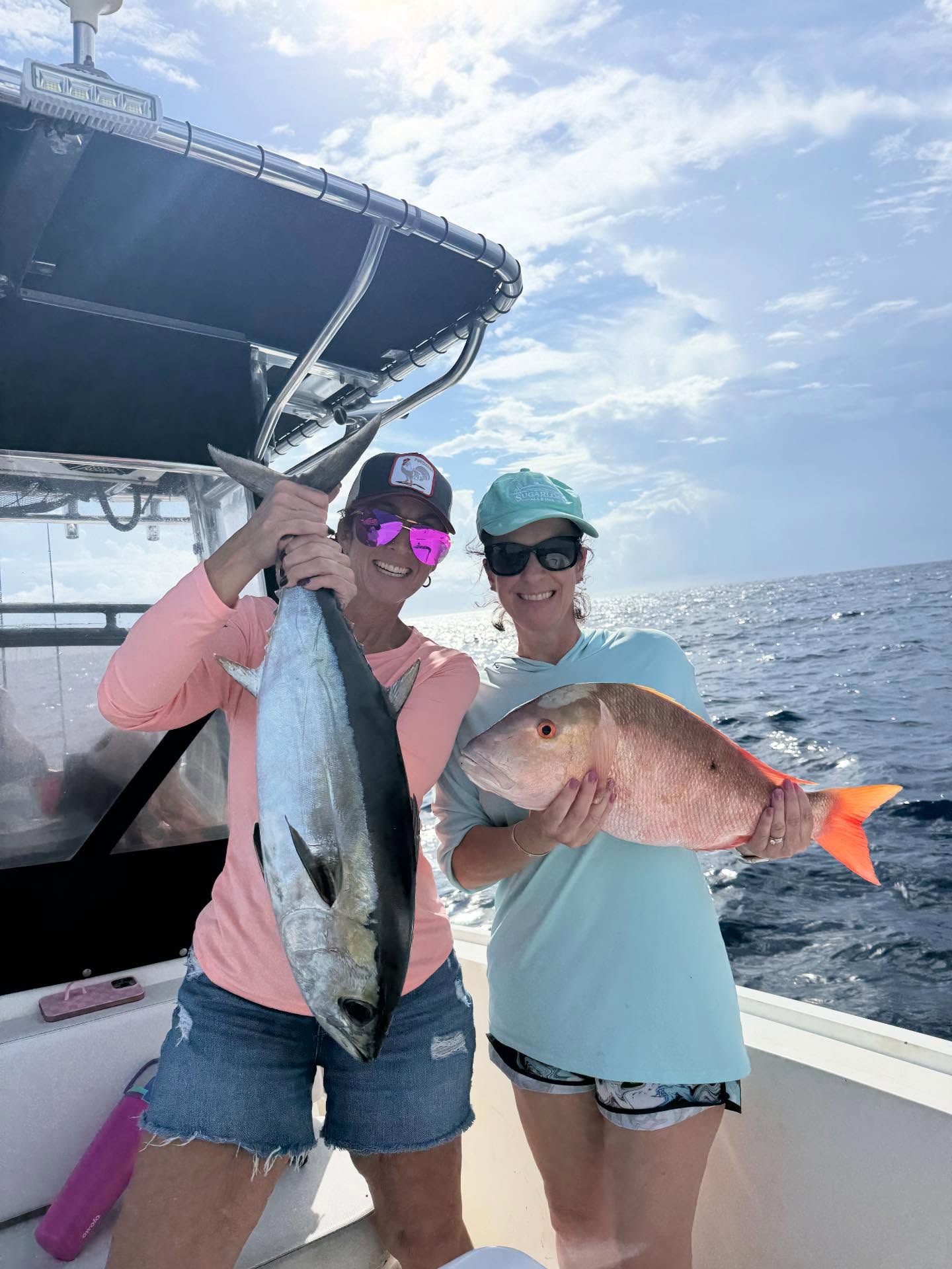 Two anglers with a blackfin tuna and grey snapper catch at Big Pine Key