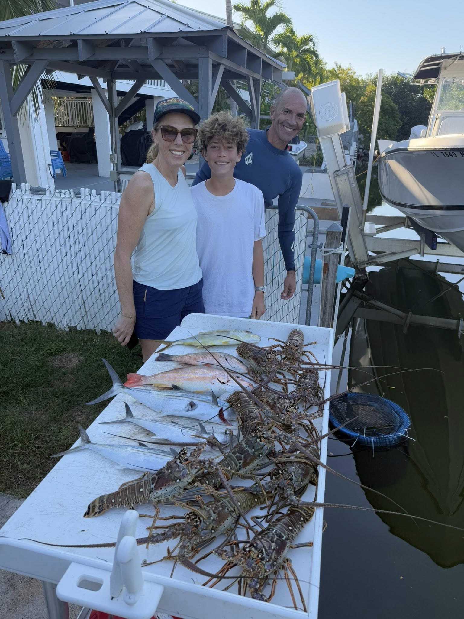 Three people fishing on the beach in Big Pine Key