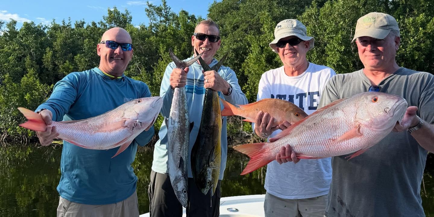 Big Pine Key fishing charter boat on reef waters with fishing gear ready for wreck diving trip