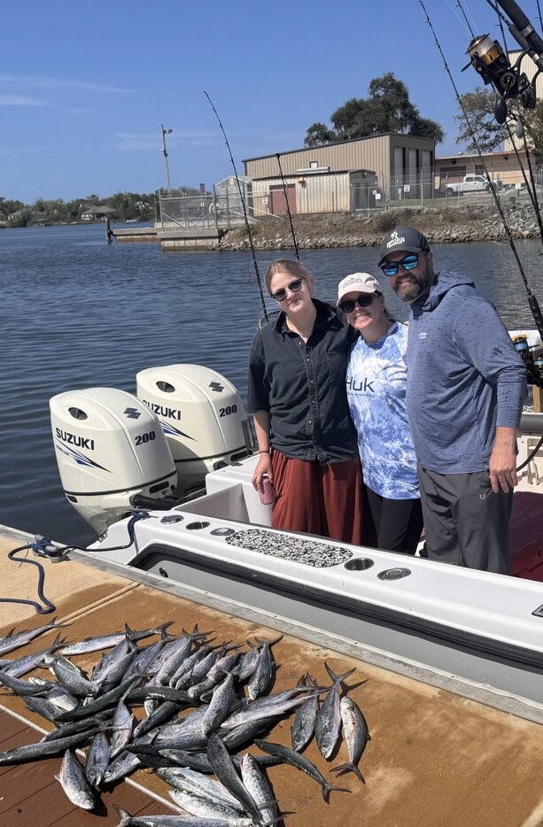 Fishing boat with fresh catch of small silver fish on deck in Panama City FL