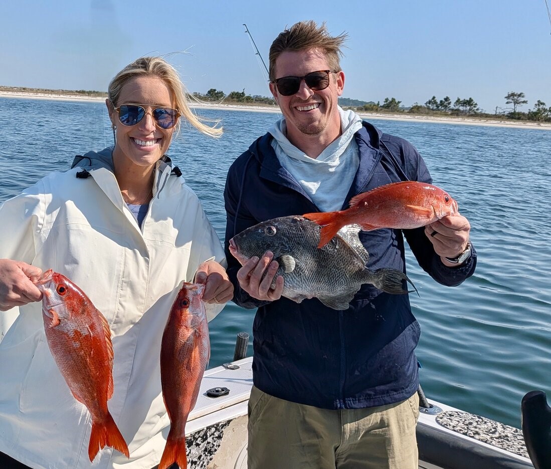 Successful fishing trip in Panama City FL showing mixed catch of red snapper and black sea bass on boat