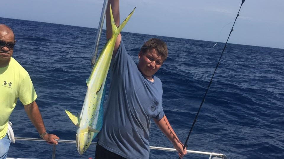 A pair of anglers holding a 40-inch fish in SC