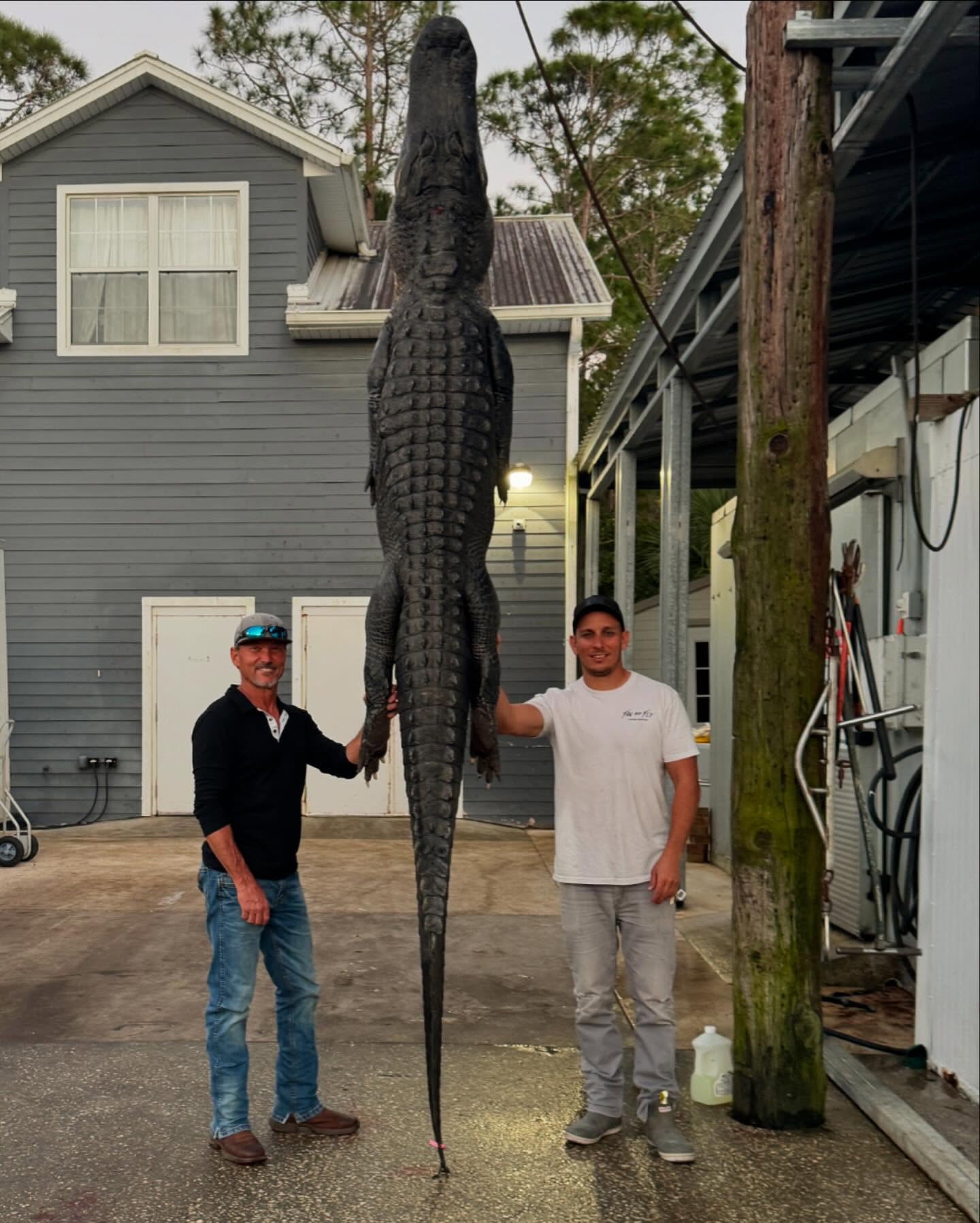 Two people fishing in Florida with one catch
