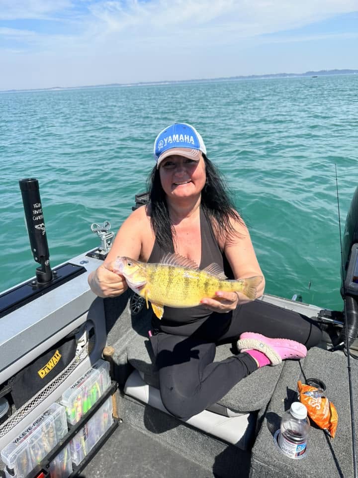Lake Erie yellow perch fishing charter boat with anglers catching fish near Port Colborne