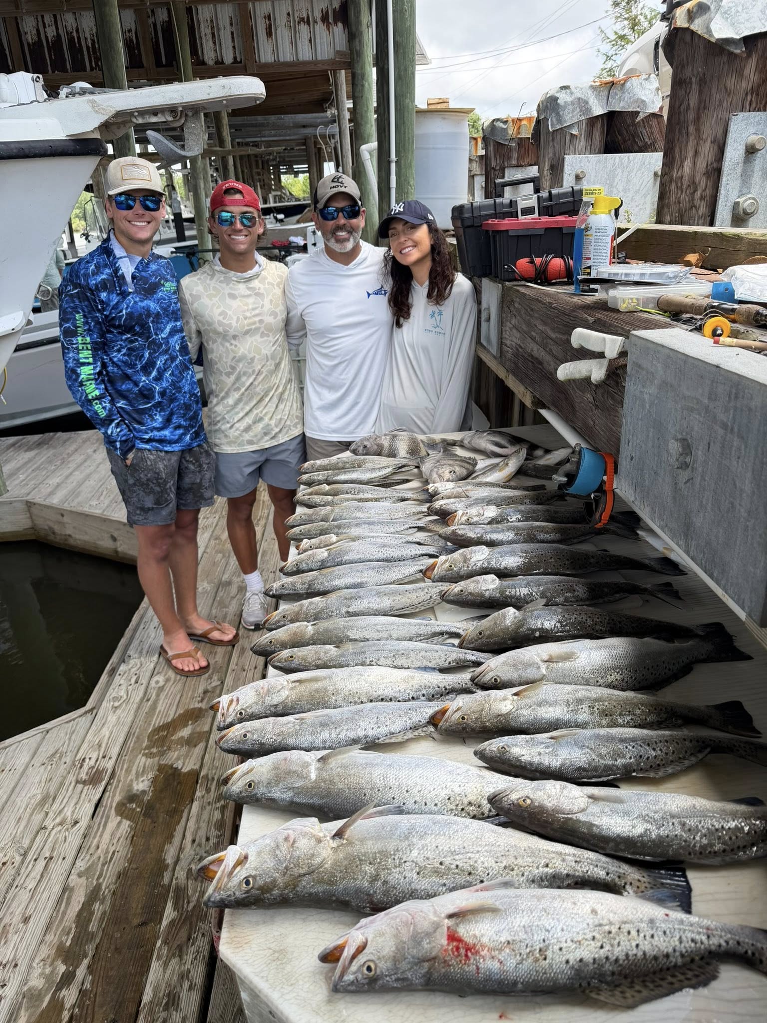 Large catch of speckled trout displayed on fishing dock in St Bernard Louisiana