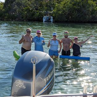 Three people enjoying a great fishing tour in Sarasota