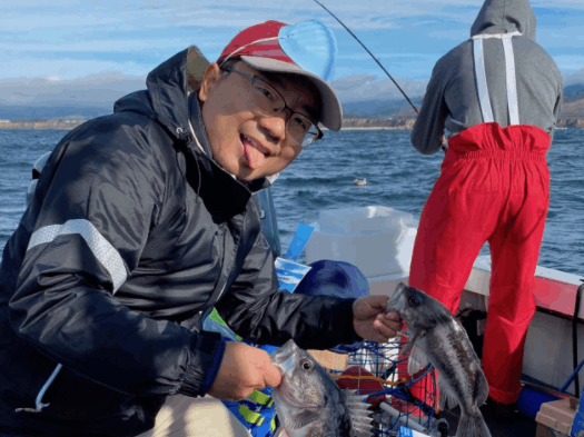 2 small fish caught by person in CA