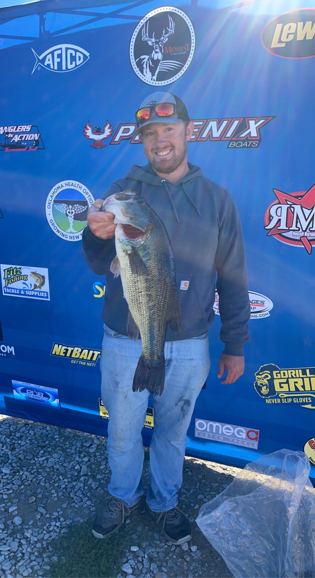 Angler posing with 20-inch fish catch in MO