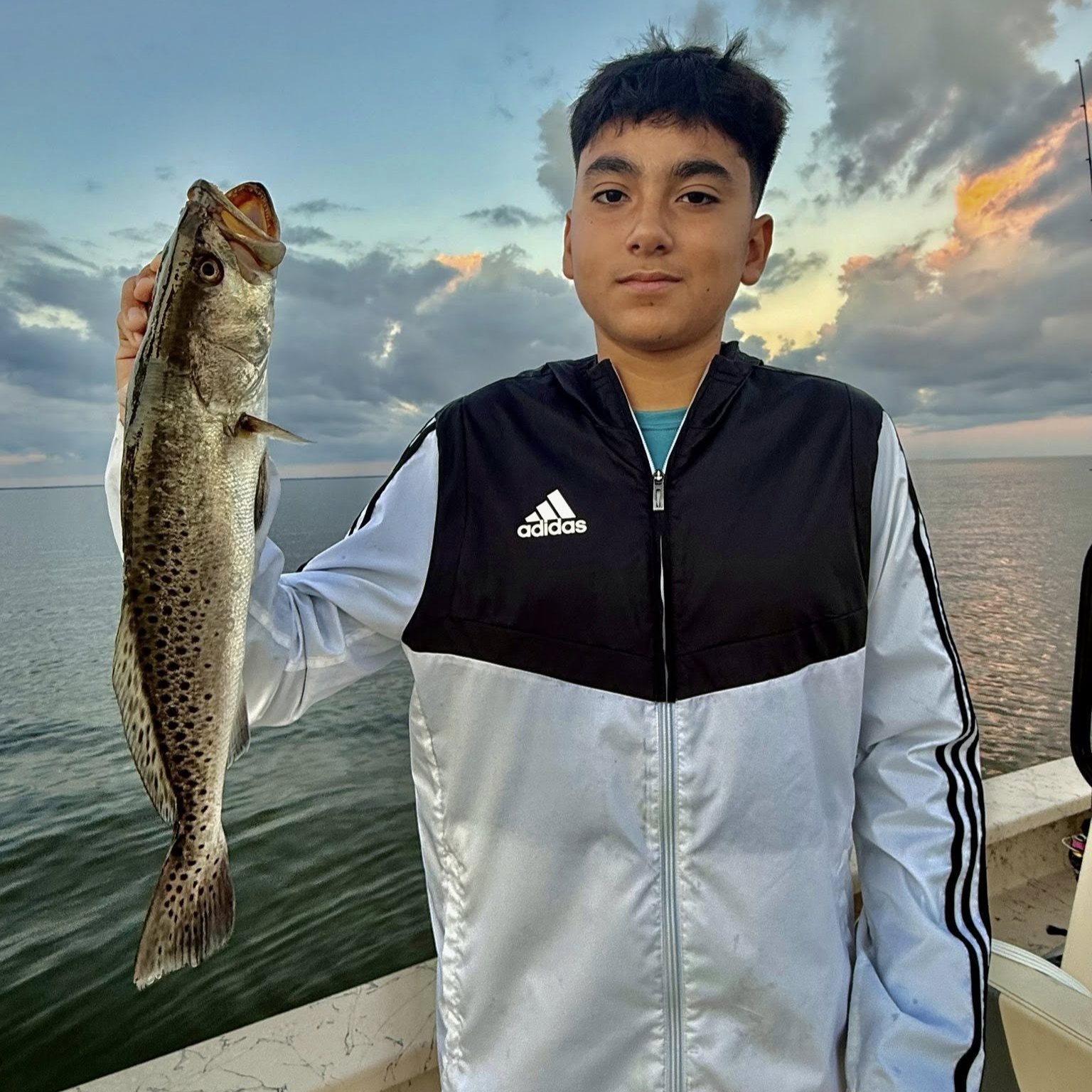 Trophy trout wade fishing in Baffin Bay shallow waters with fishing guide and angler