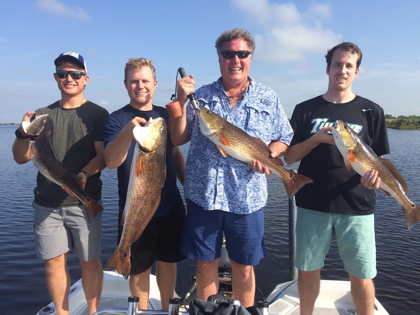 A group of 4 anglers fishing in LA with a haul of 4 large fish