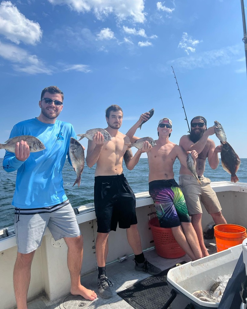 4 people enjoying fishing trip in NJ
