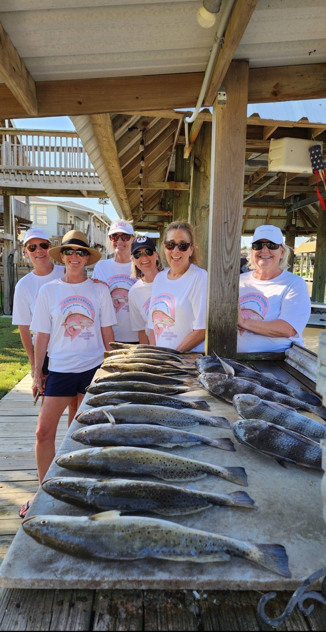 Multiple speckled trout laid out on fishing dock at Bolivar Peninsula TX
