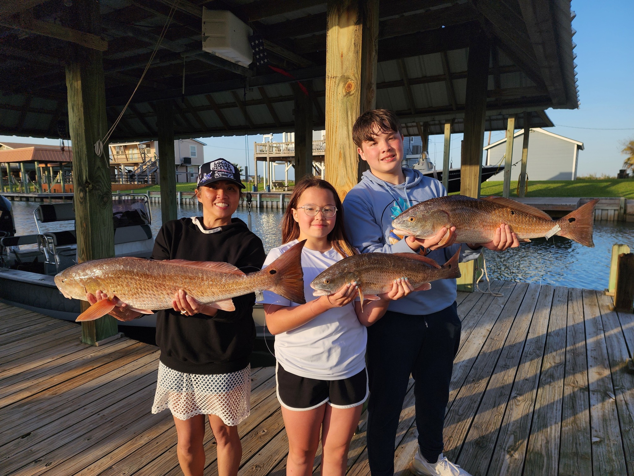 Galveston Bay family fishing charter boat targeting redfish, trout, flounder in shallow waters