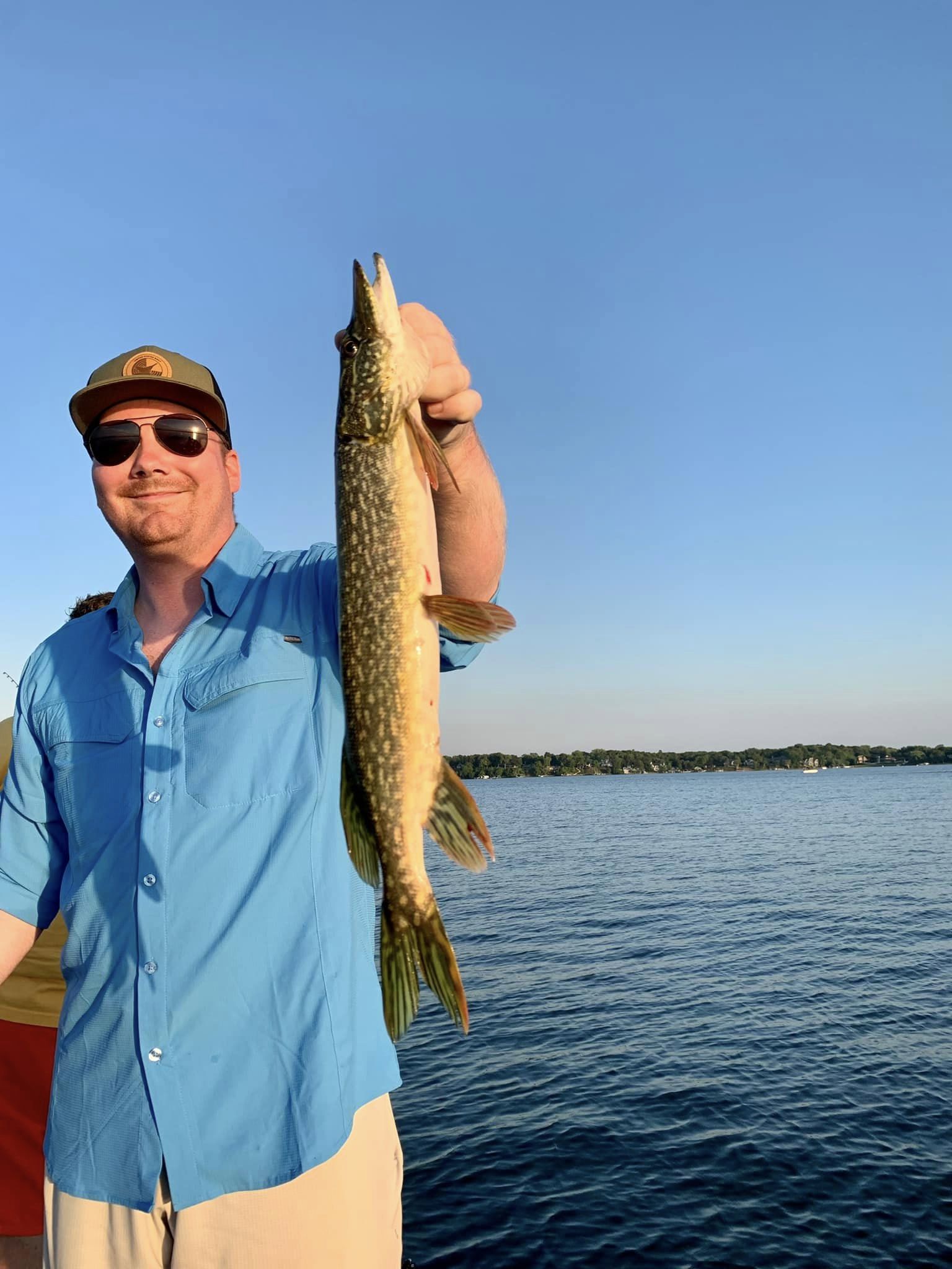 A lone angler in Minnesota fishing on the water