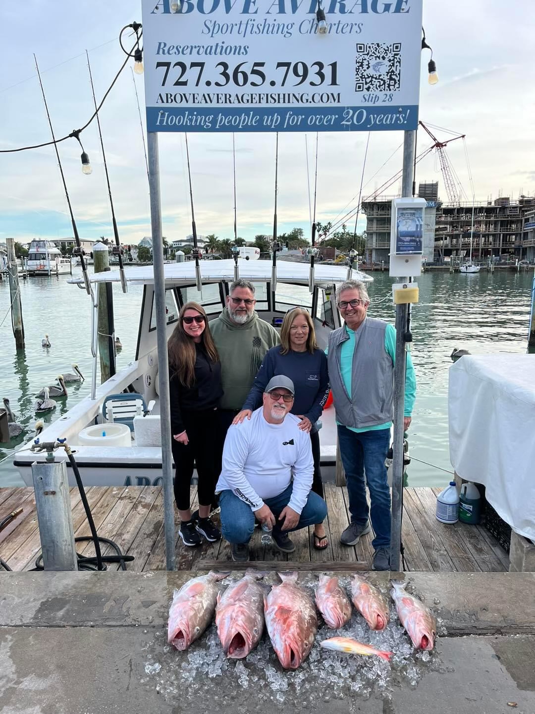 5 people fishing on the beach in Clearwater Beach