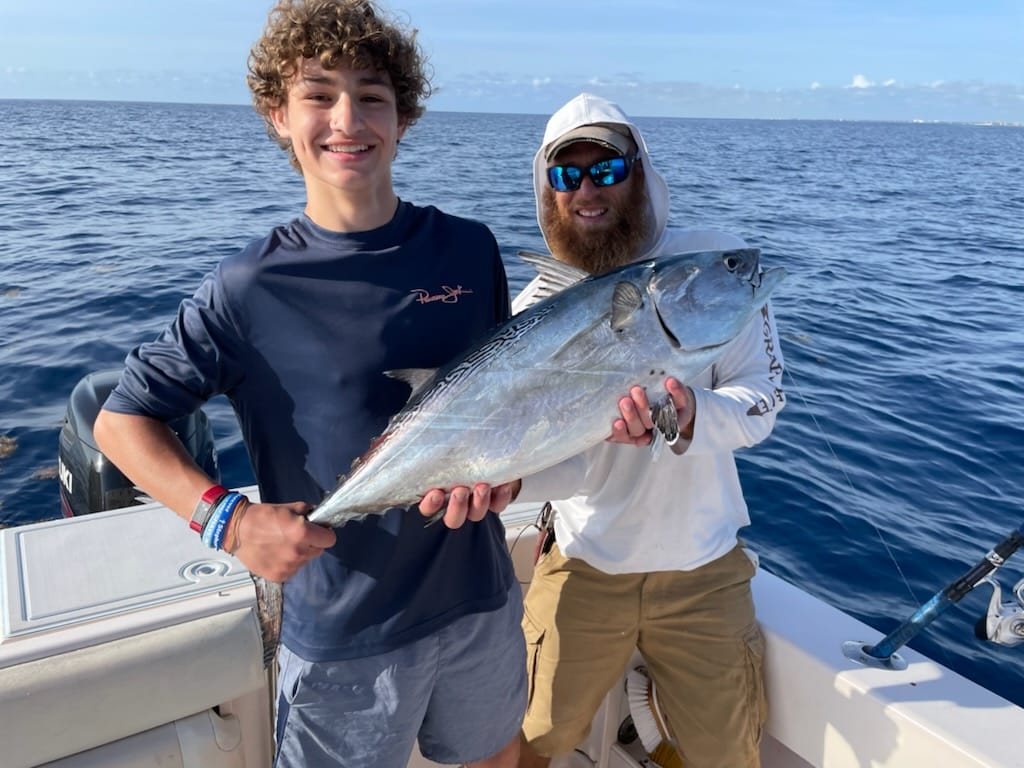 A group of 2 people fishing at a location in FL